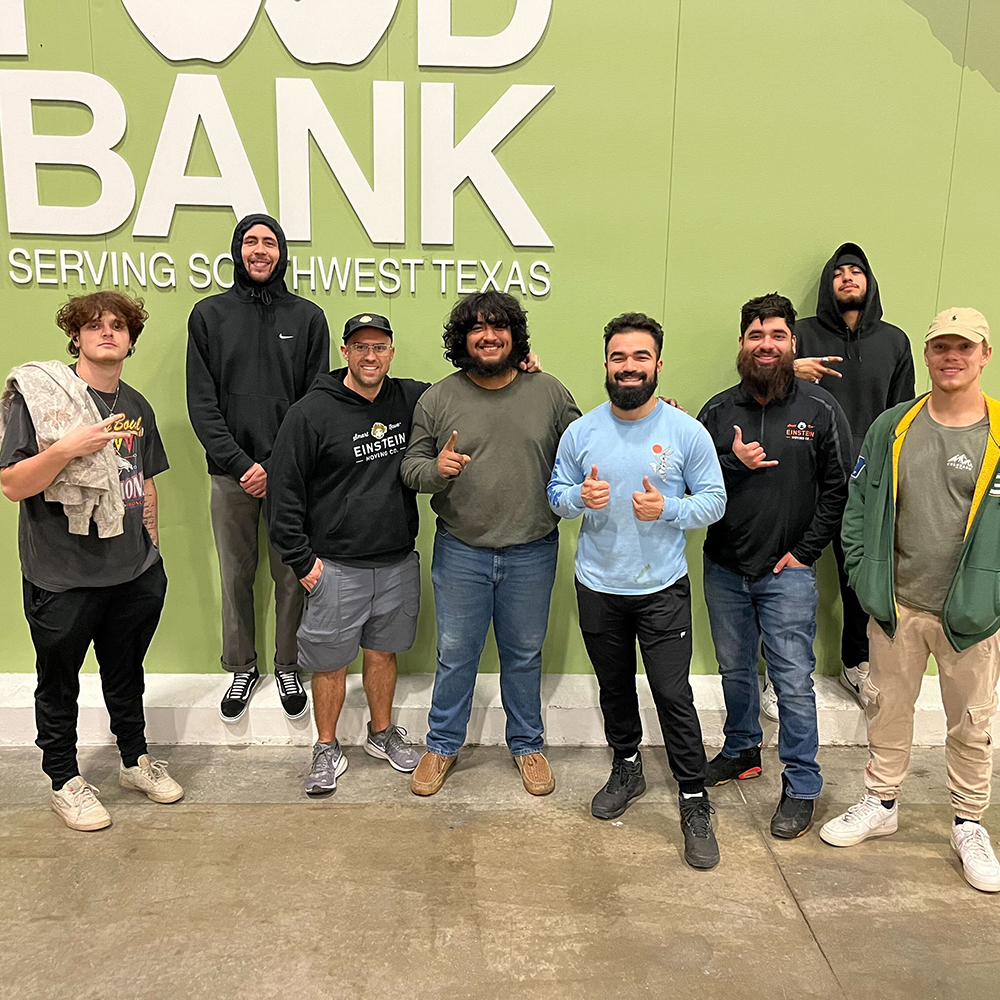 Our Einstein movers posing in a group photo at the San Antonio foodbank.