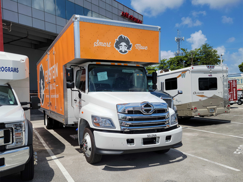 Moving truck parked in a parking lot in miami.